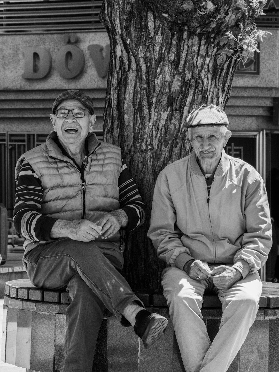 Group of smiling Croatian senior citizens laughing together in a sunny park